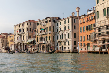 Fototapeta na wymiar Panoramic view of Grand Canal (Canal Grande) with active traffic gondolas