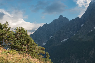 Panorama of mountains and forest scene in national park of Dombay, Russia