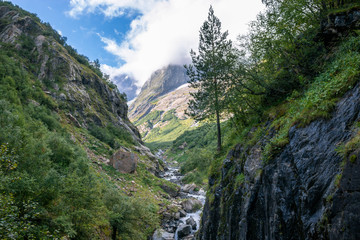 Fototapeta na wymiar Panorama view of mountains scene in national park of Dombay, Caucasus, Russi