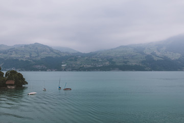 View on lake Thun and mountains from ship in city Spiez, Switzerland