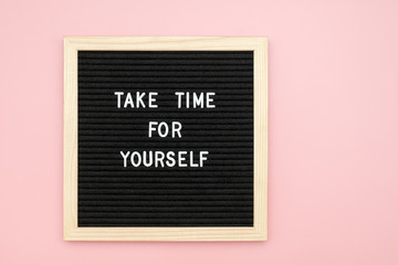 Take time for yourself. Motivational quote on letterboard on pink background. Top view Flat lay...
