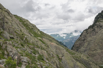 Fototapeta na wymiar Closeup mountains scenes, walk to Trift Bridge in national park Switzerland