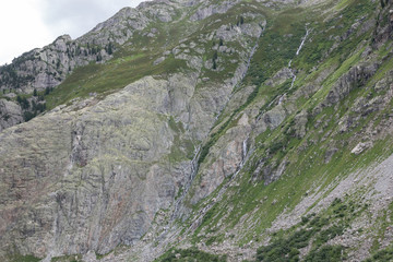 Closeup mountains scenes, walk to Trift Bridge in national park Switzerland