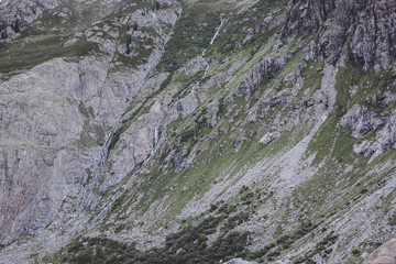 Fototapeta na wymiar Closeup mountains scenes, walk to Trift Bridge in national park Switzerland