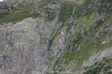 Closeup mountains scenes, walk to Trift Bridge in national park Switzerland