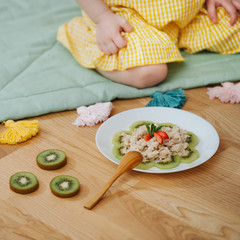 oatmeal with Kiwi and strawberries in the playroom