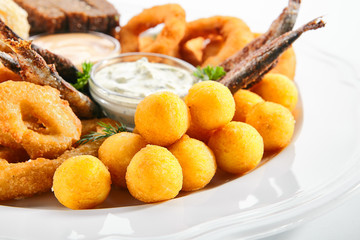 Beer Snacks or Beer Plate with Fried Seafood, Onion, Cheese and Sauces