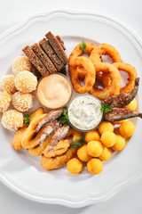 Beer Snacks or Beer Plate with Fried Seafood, Onion, Cheese and Sauces