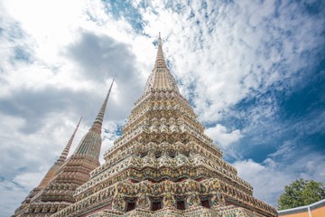The pagodas of The first four kings of the current dynasty of Thailand under blue sky