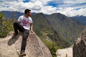 Traveller at the Lost city of the Incas, Machu Picchu,Peru on top of the mountain, with the view panoramic