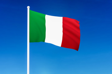 Waving flag of Italy on the blue sky background
