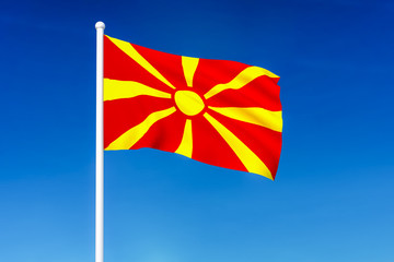 Waving flag of Macedonia on the blue sky background