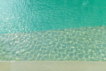 Stone border in front of swimming pool