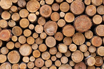 Möbelaufkleber Stacked Wood Logs Pattern Background © Myk Crawford
