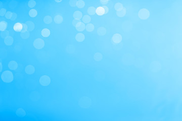 Blue bokeh image for background, Empty space. Blurred bright light.