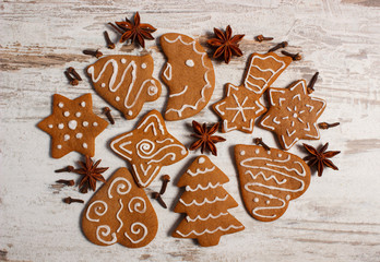 Fresh baked gingerbread with spices on old board. Christmas time