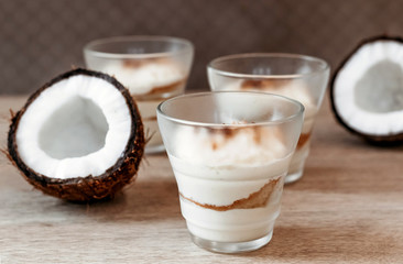 Coconut tender dessert in cafe. Dessert in glass for Valentine's day.