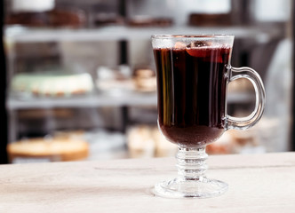 Mulled wine in cafe. Autumn winter hot alcoholic drink.