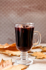 Mulled wine in cafe. Autumn winter hot alcoholic drink.