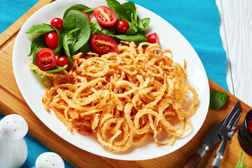 spinach and tomato salad, crispy fried onions