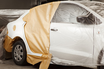 Repairing car body, surface preparation for spray painting.
