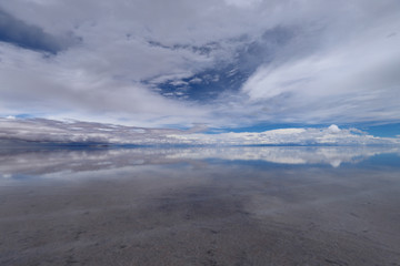 The Salar de Uyuni flooded after the rains, Bolivia. Clouds reflected in the water of the Salar de Uyuni, Bolivia