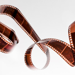Fototapeta na wymiar Twisted undeveloped film strip isolated on white background