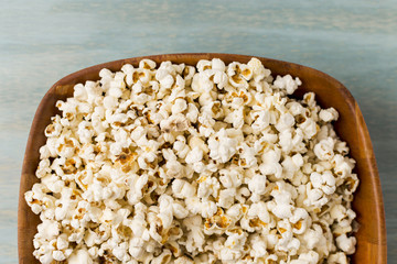 Popcorns in the wooden tray