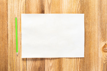 Sheet of paper lying on wooden table