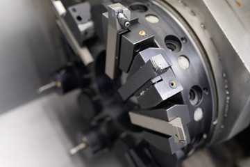 Fototapeta premium Close-up of the working machine mechanisms in the factory of the metal details
