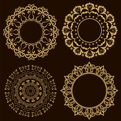 Set of circular ornaments on a black background.