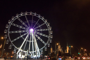 night ferris wheel illuminated with lights