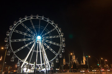 night ferris wheel illuminated with lights