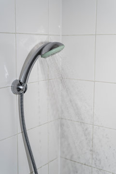 Close up of Water flowing from shower in the bathroom