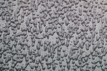 Drops of water on a glass surface