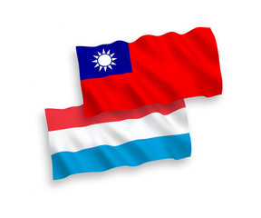 National vector fabric wave flags of Taiwan and Luxembourg isolated on white background. 1 to 2 proportion.