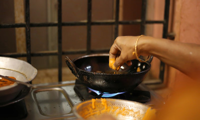 Happy Young Woman Preparing Tasty Snacks At The Kitchen