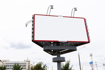 Empty billboard with red frame and copyspace for commercial ads. © Ivan Traimak
