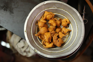 Indian takeaway food, spicy onion bhajis on plate