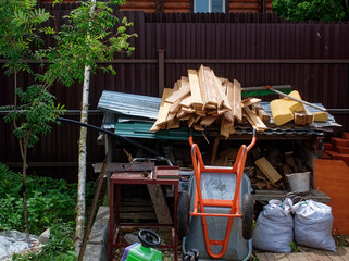 building materials in the yard of a rural house, Russia.