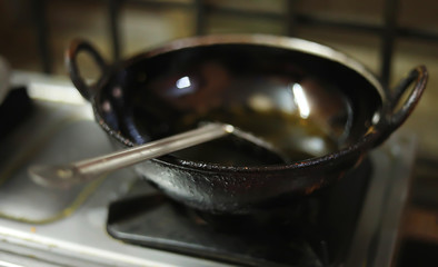 Closeup on fried in a pan at home kitchen