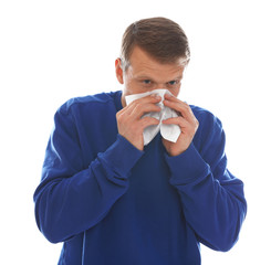 Man suffering from cold on white background