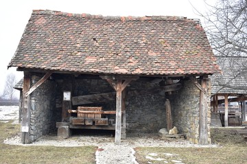 Fototapeta na wymiar Wooden house in winter landscape in Romania