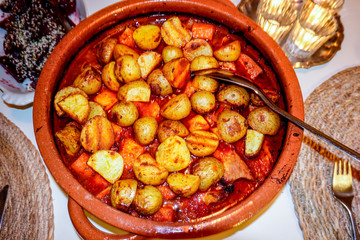 Stockholm, Sweden A stew with grilled potatoes and wine and carrots and pork.