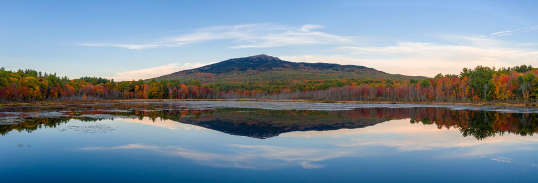 Mount Monadnock, New Hampshire. Aerial drone view over water in autumn with reflection.