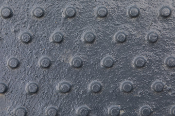 Close-up of shiny dark tactile surface with pimps