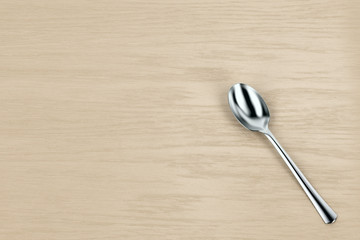Silver spoon on table