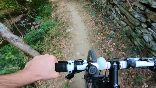 Downhill pov view with mountain bike