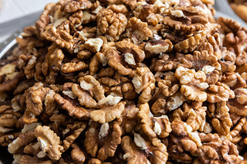 Walnut seeds, nuts backdrop for healthy nutrition