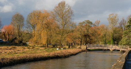The River Coln through Bibury a picturesque village in The Cotswolds, Gloucestershire,UK
